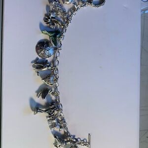 Sterling Silver Multi-Charm Bracelet with 13 charms.